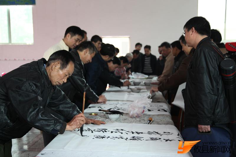 “攸县精神”现场给力挥墨
